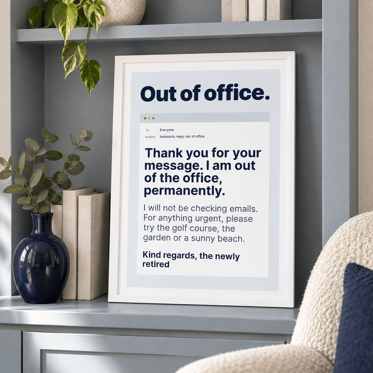Funny out of office retirement print leaning on a shelf beside books and plants