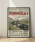 Graphic motorsport wall art showing a race car on a sweeping circuit with stands and powerline towers
