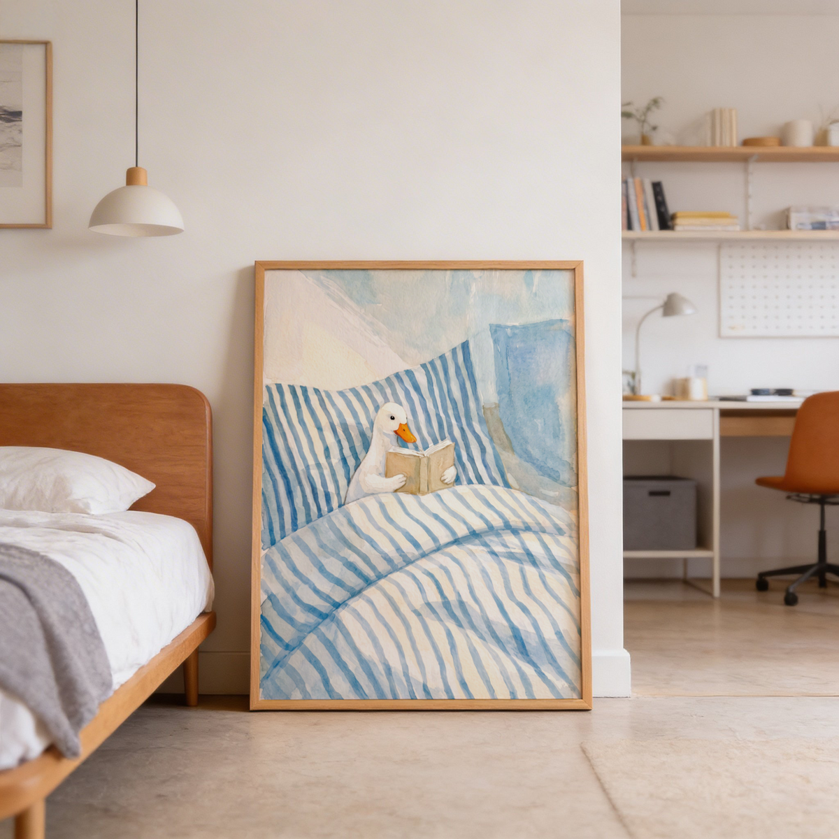 Storytime wall art print showing a duck holding a book against layered striped bedding