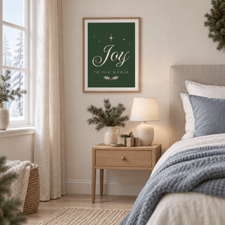 Green and cream Christmas print above a bedside table in a calm bedroom