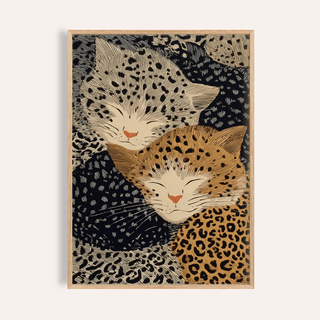 Framed close-up of Leopard print wall art showing two sleeping leopards in beige and brown tones
