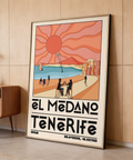 Graphic travel poster print featuring El Medano Tenerife beach, café table silhouettes, and seaside buildings