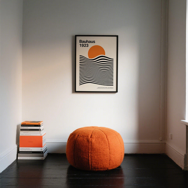 Bauhaus-inspired Sun and Mountain Wall Art in orange, black, and cream tones.