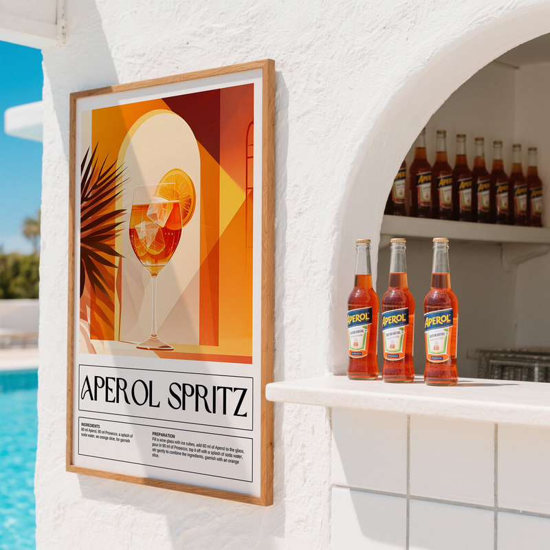 Framed Aperol Spritz poster on a white wall with bottles in the background.
