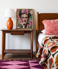 Painted-style Frida Kahlo portraits for sale in lush botanical background.