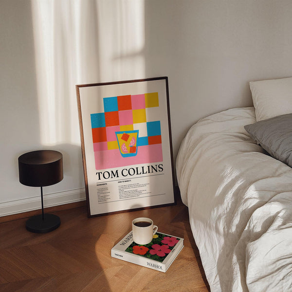 Tom Collins gin drink print with lemon slices and ice cubes in a tall glass.