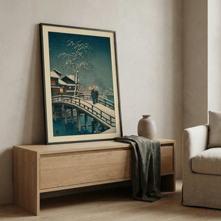 Hasui Kawase snow print displayed above a minimalist reading nook