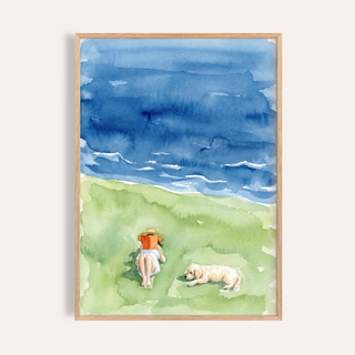 Above view watercolor wall art poster of a reader on grass by the sea with waves and a resting dog
