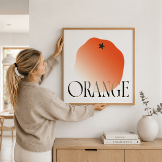 Typographic fruit wall art print featuring an orange shape and the word ORANGE