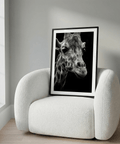 Giraffe Photography Poster framed view against dark negative space