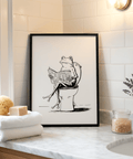 Black and white linework poster of frog holding an open newspaper while seated on a toilet