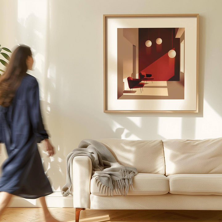 Art for Office Walls framed print of mid-century chairs and lighting in red and beige on a cream wall above a sofa