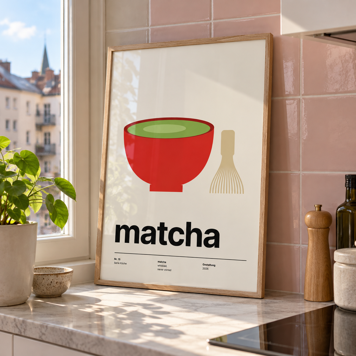 Swiss style matcha typography print in a kitchen window against a pink wall