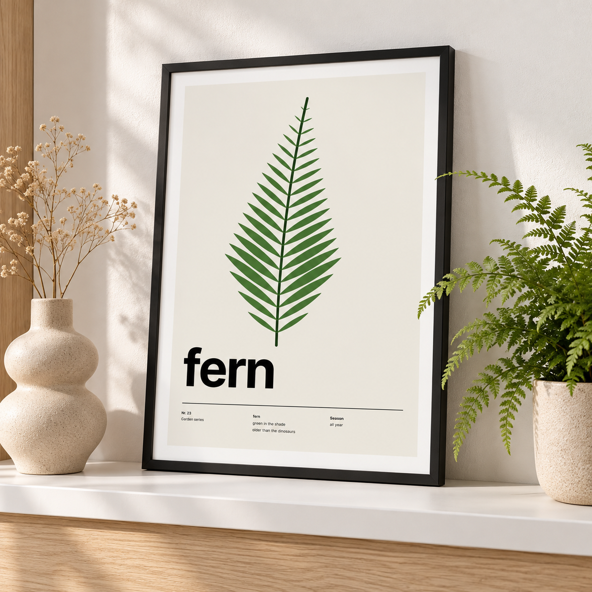 Swiss style fern leaf print leaning on a picture ledge with books