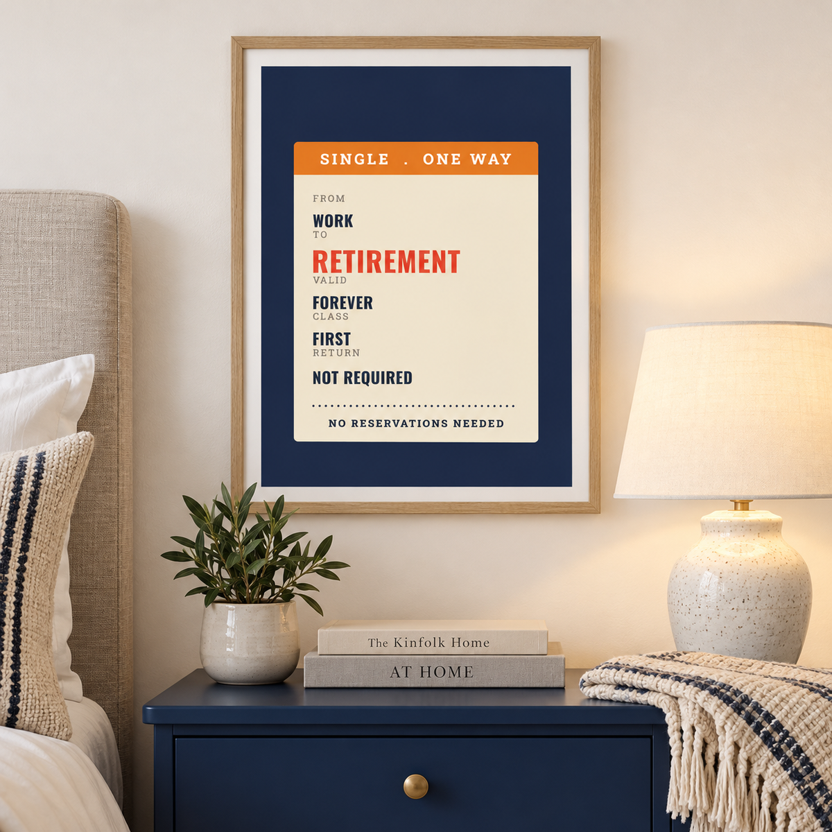 Navy and cream ticket print above the bed in a calm bedroom