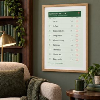 Funny golf retirement print in a home library with wooden shelves