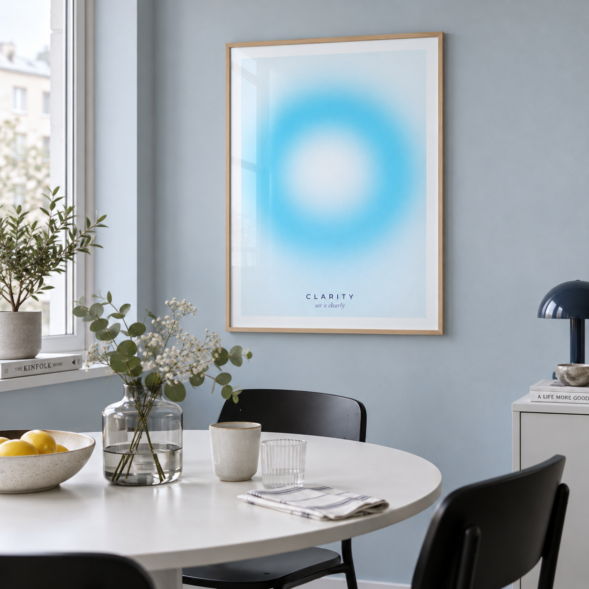 White and aqua halo print in a dining against a blue grey wall