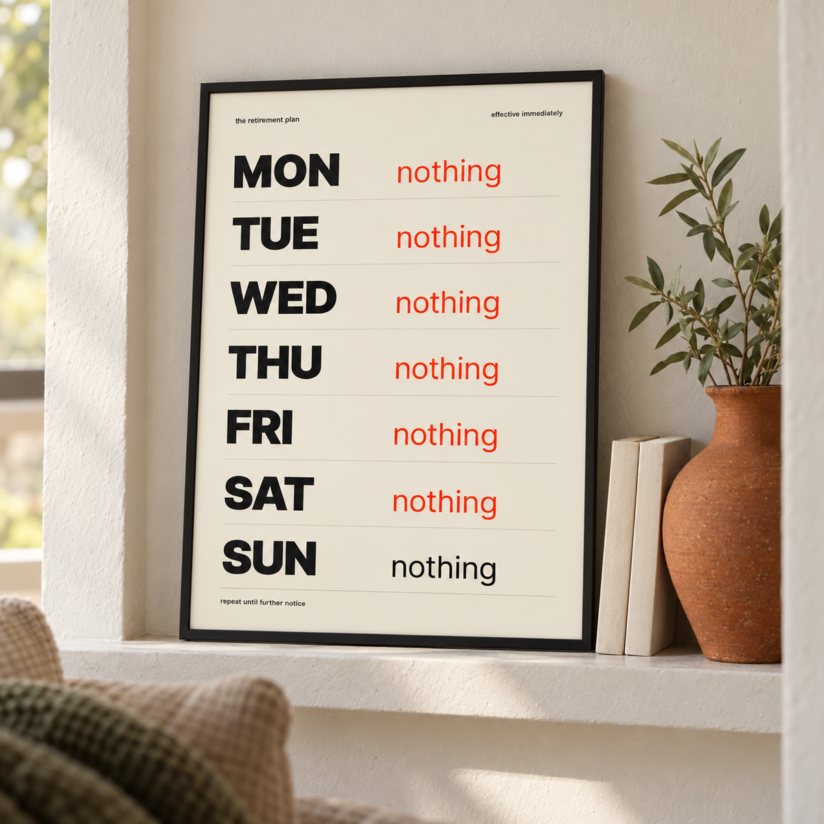Funny retirement plan print leaning on a shelf beside books and plants