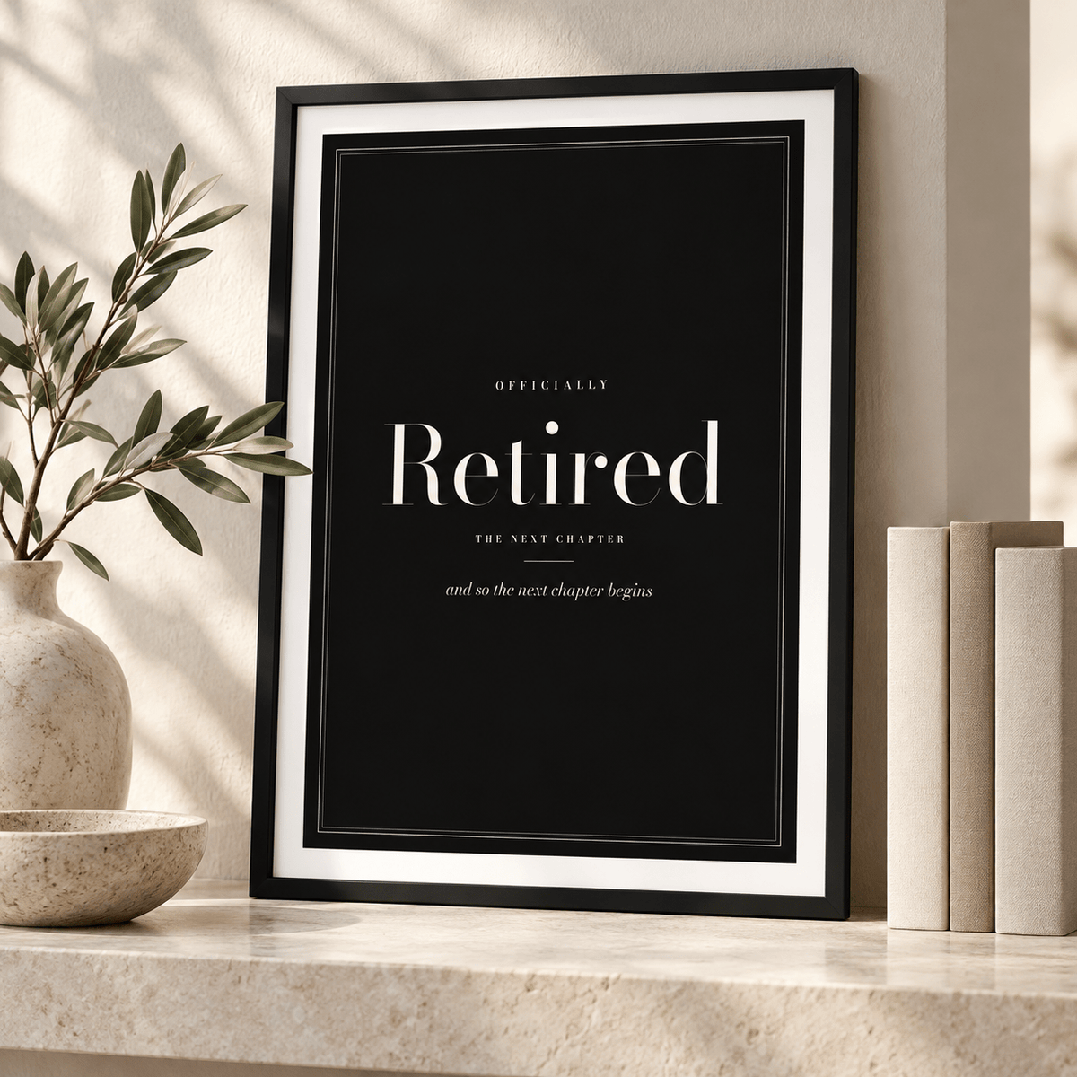 Elegant retired typography print leaning on a shelf beside books and plants