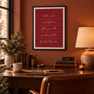 Red and cream Christmas quote print in a home study at Christmas