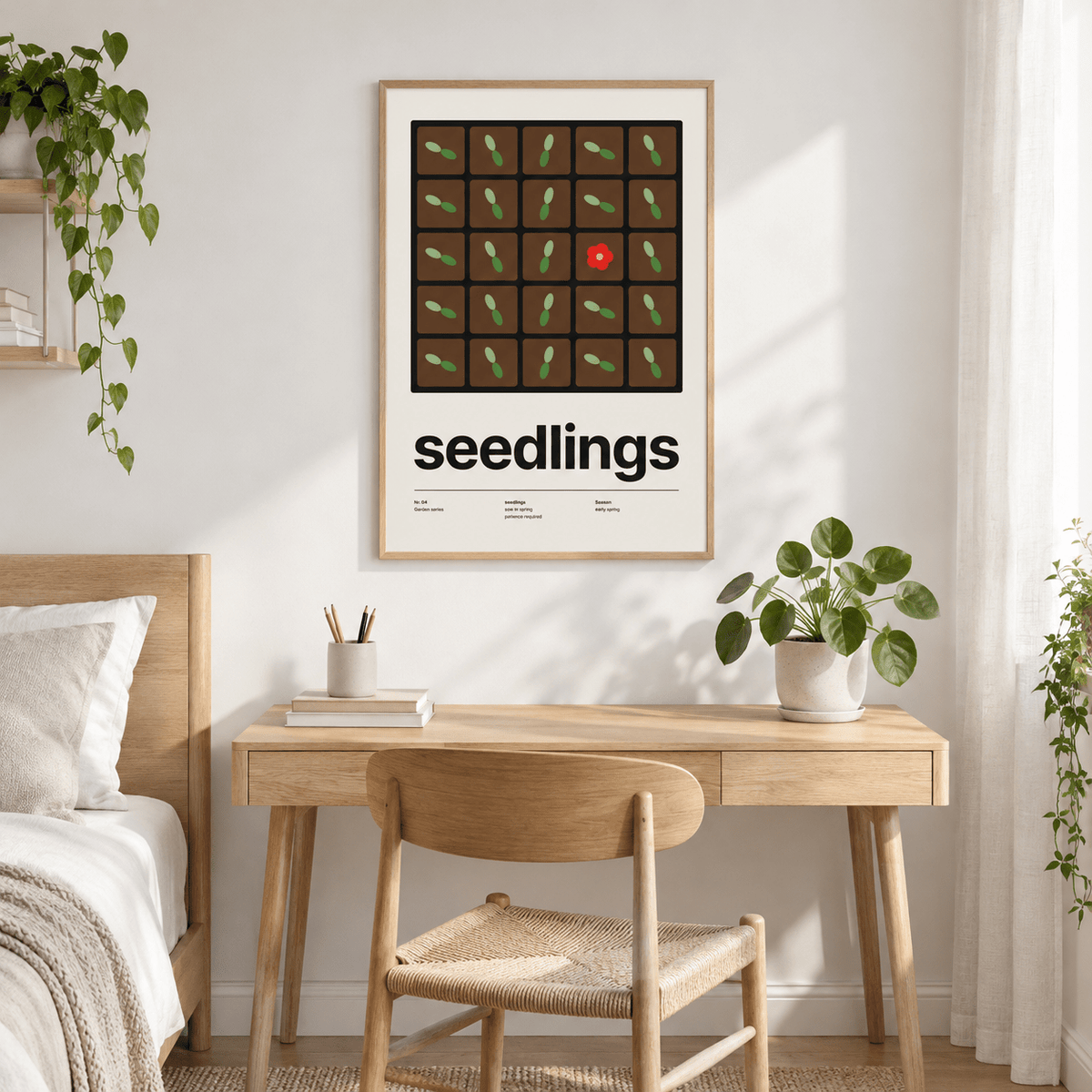 Swiss style seedlings print above a small desk in a calm bedroom