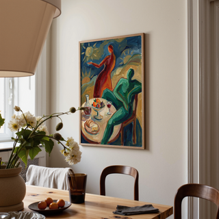 Circular sun motif painted above dinner setting in bold strokes