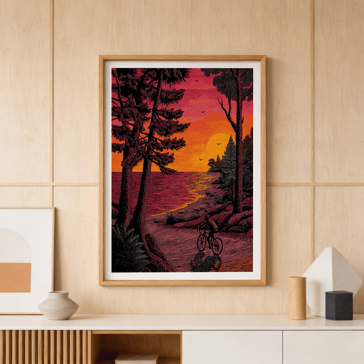 Sunset lakeshore scene wall art print showing a cyclist on a winding road and birds in the sky