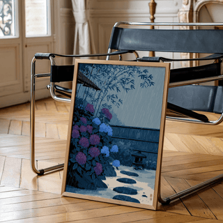 Close-up of Japanese Rain Print wall art with hydrangea blossoms and layered leaves in the foreground