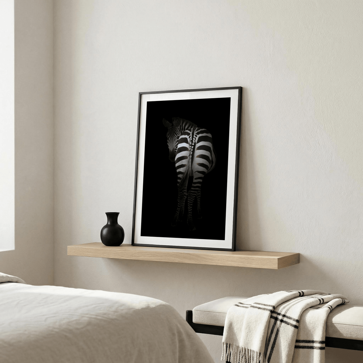 Monochrome zebra standing against deep negative space