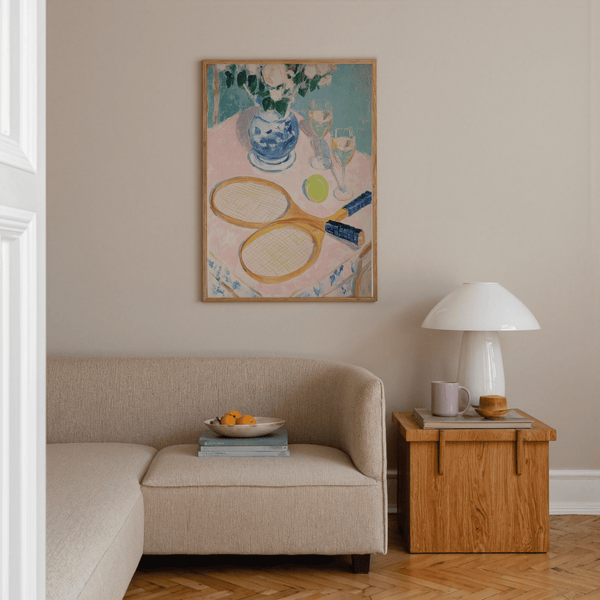 Artwork poster featuring a blue-and-white vase with flowers behind tennis equipment