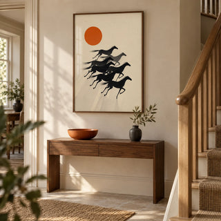 7 Horses Wall Art, framed on the wall of a warm modern hallway in a UK townhouse with a pale stone wall and simple timber staircase