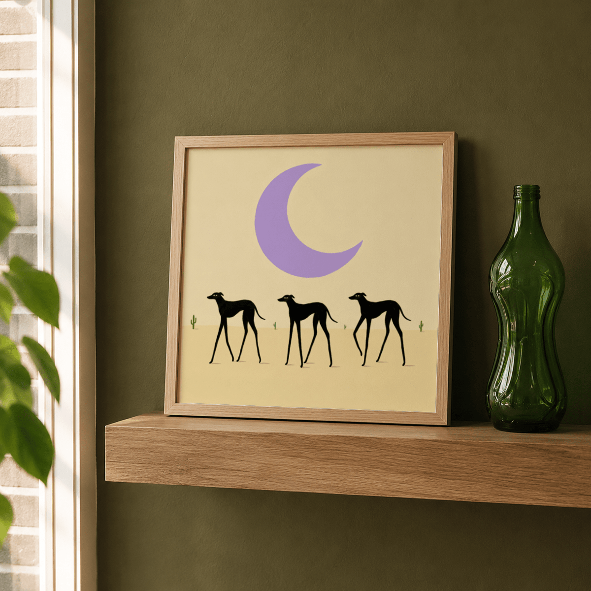 Simple illustration print with three dog silhouettes and a wide band of negative space
