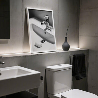 White sink with bold hygiene message on wash hands sign.