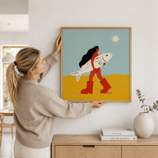 Stylized woman with long hair carrying a fish art print with flat shapes