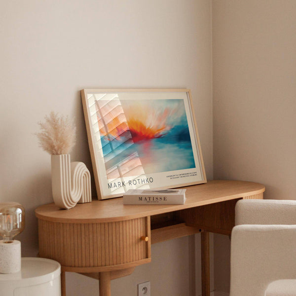 Fiery red and orange sunrise painting with calming blue shades.