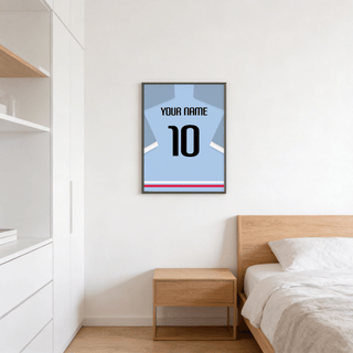 Featuring a light blue football shirt poster with bold black number 10 and name text