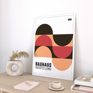 Contemporary home office wall art with peach, black, and red tones