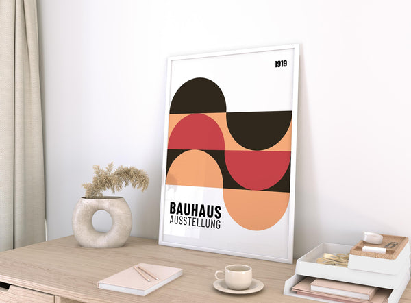 Contemporary home office wall art with peach, black, and red tones