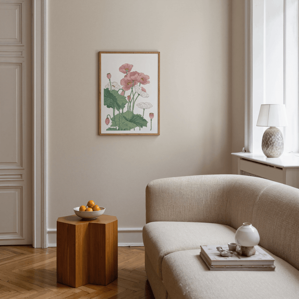Living room with beige sofa, wooden side table, and floral artwork on the wall.