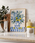 Olive tree wall art print styled for kitchen decor with cool coastal colors.