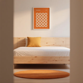 A flat-lay view of orange poster with circular forms and modernist typography.