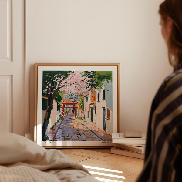 Cherry blossom petals fall on a quiet Kyoto road in this Kyoto Japan Art print.