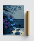 Rainy courtyard print with hydrangea bushes, flat stones, and a distant fence