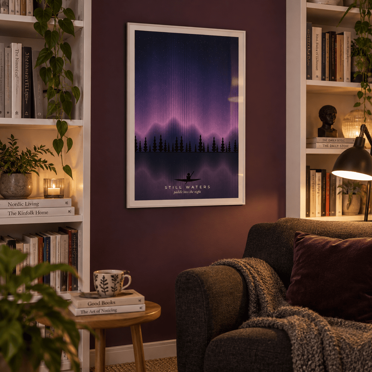 Pink aurora over a lake with a canoe print in a home library
