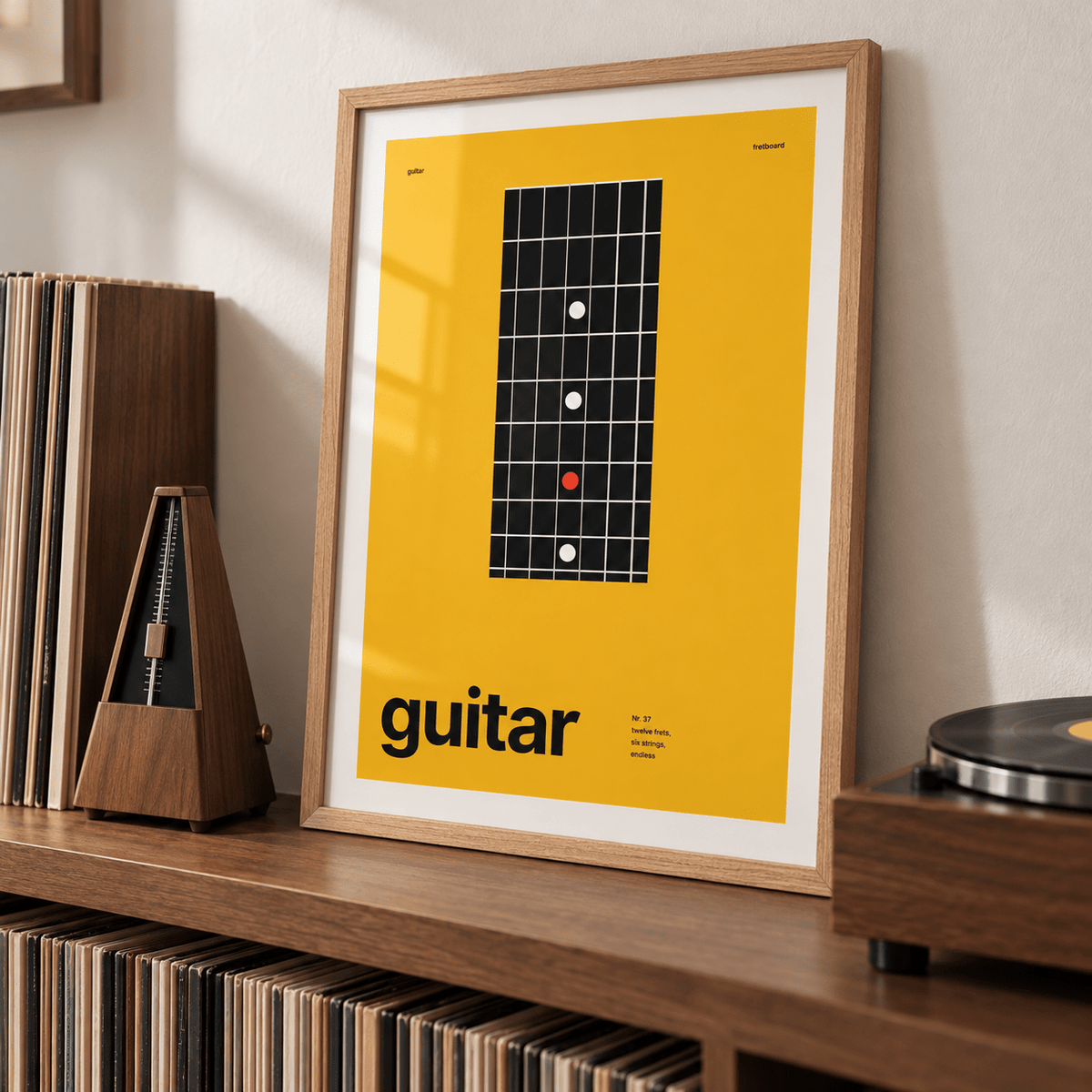 Guitar fretboard close up print on a ledge above a record collection