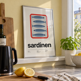 Open tin of sardines print on a ledge in a kitchen window against a yellow wall