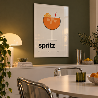 Orange spritz in a balloon glass print in a dining room against an olive wall