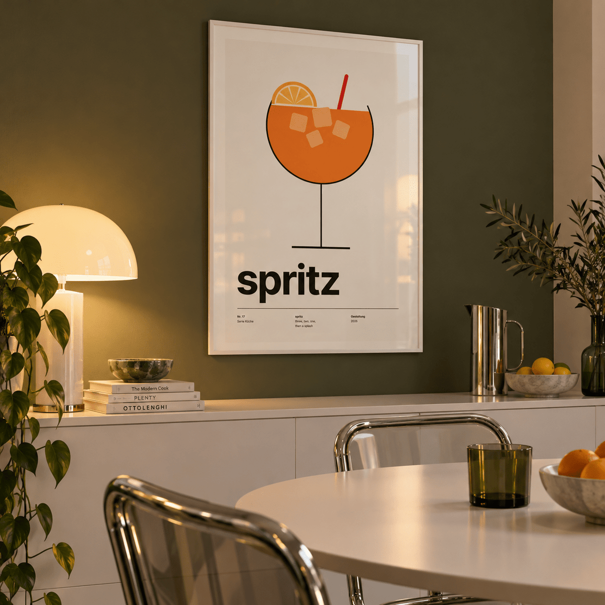 Orange spritz in a balloon glass print in a dining room against an olive wall