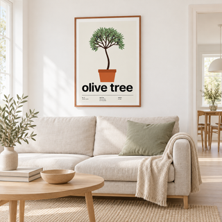 Potted olive tree print above a sofa in a light living room
