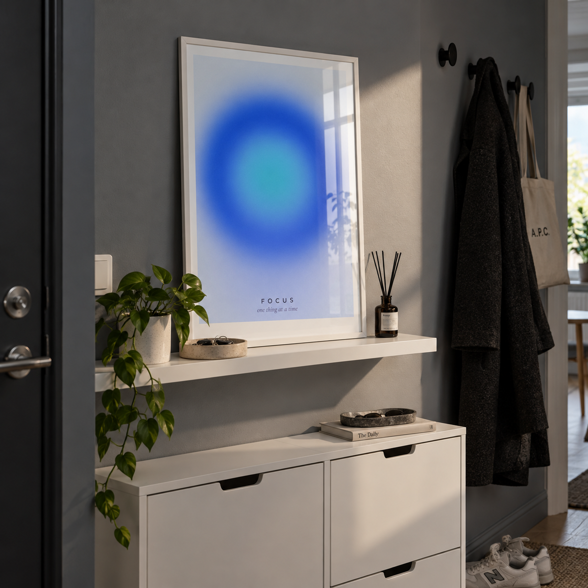 Deep blue and turquoise focus print on a ledge in a hallway against a slate wall